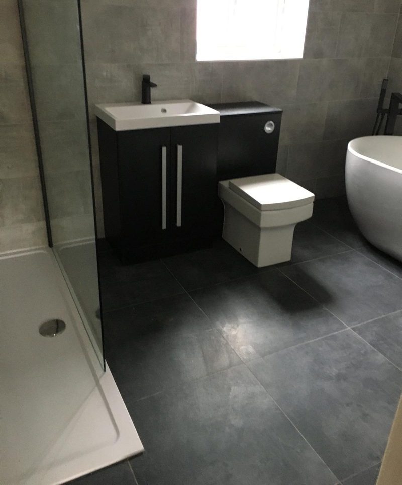 Large-format grey floor and walls