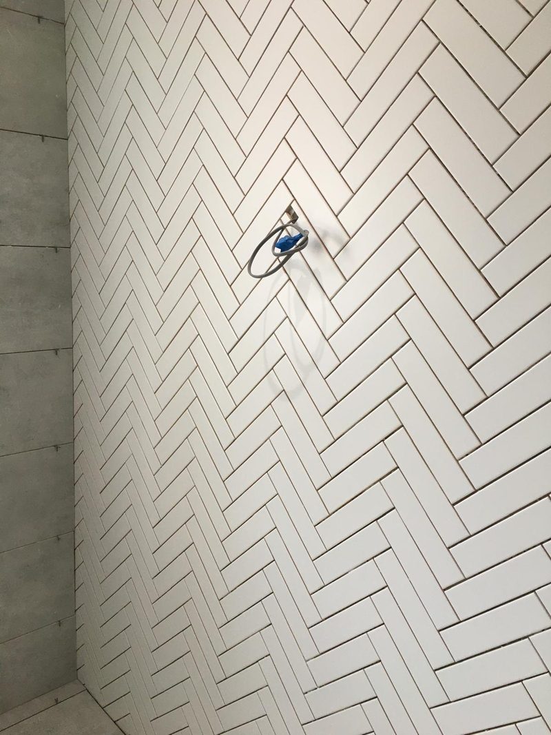 White herringbone shower wall