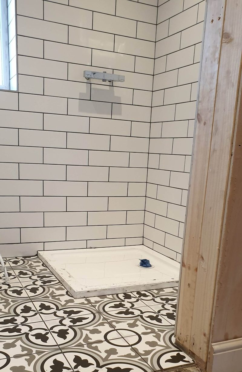 Patterned floor with white metro walls