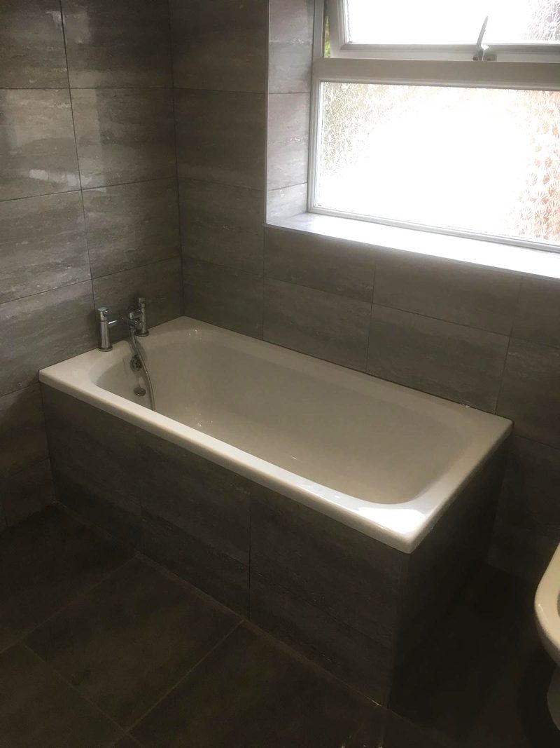 Tiled bath panel and walls